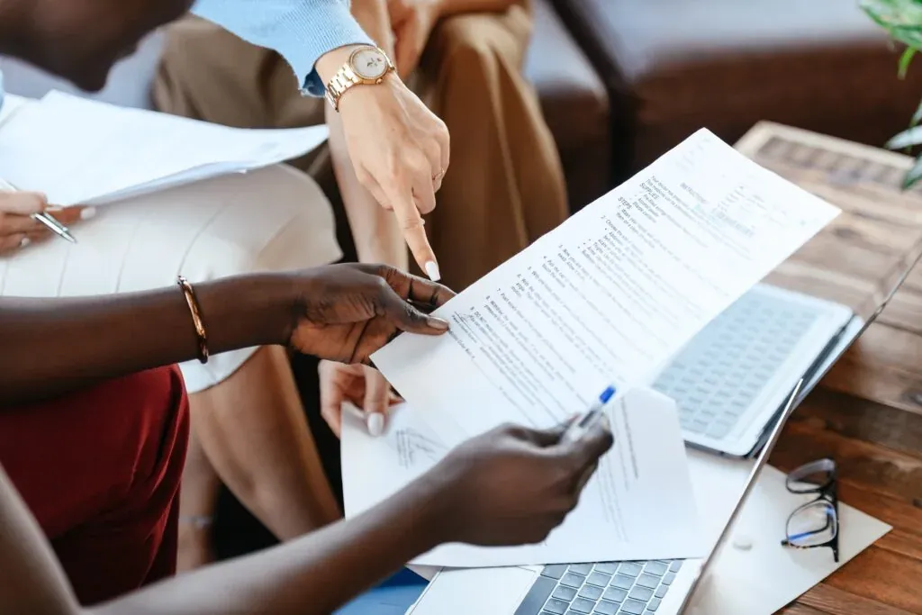 Store owner and employee analyzing results